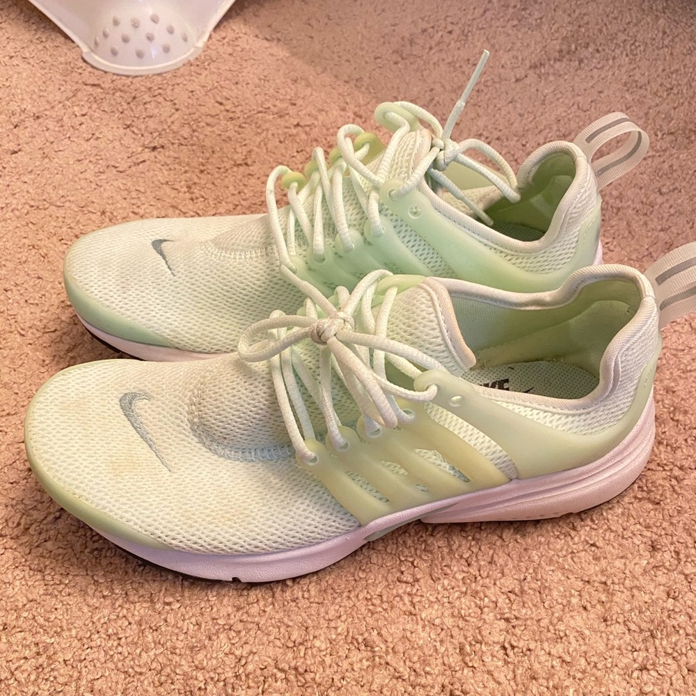 Mint green Nike running shoes